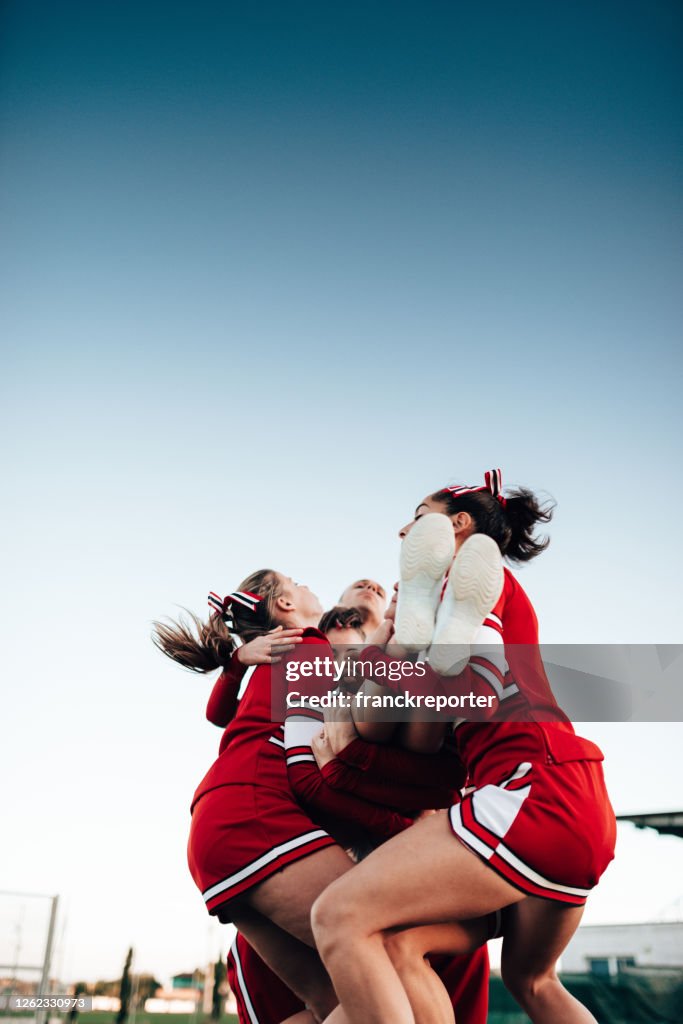 Cheerleaders Throw Up A Girl In The Air High Res Stock Photo Getty Images cheerleaders-throw-up-a-girl-in-the-air-high-res-stock-photo-getty-images