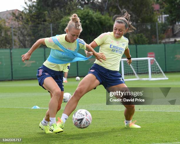 Katie McCabe challenges Leonie Maier of Arsenal during the Arsenal Women training session at Arsenal Academy on July 29, 2020 in Walthamstow, England.