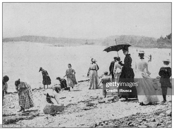 antique black and white photo: people on coney island - archival beach stock illustrations