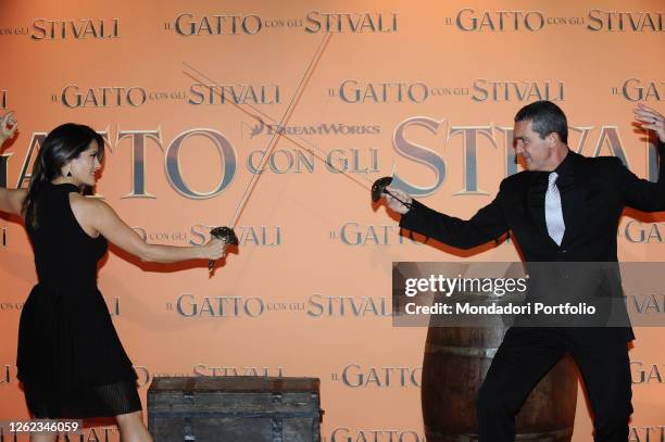 The Spanish actor Antonio Banderas and the Mexican actress Salma Hayek participate in the premiere of the animated film The Puss in Boots at the UCI...