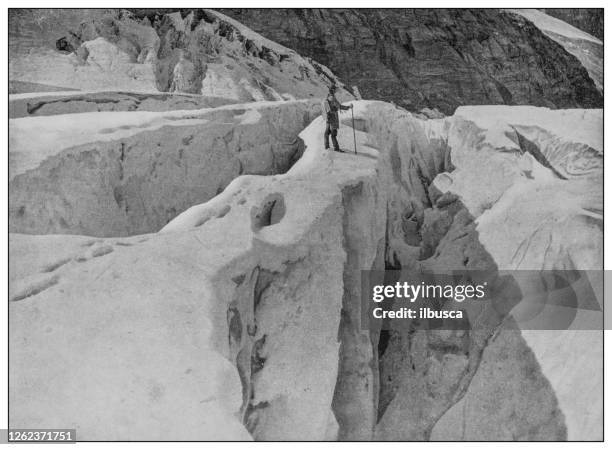 antique black and white photo: asulkan glacier crevasses - crevasse stock illustrations
