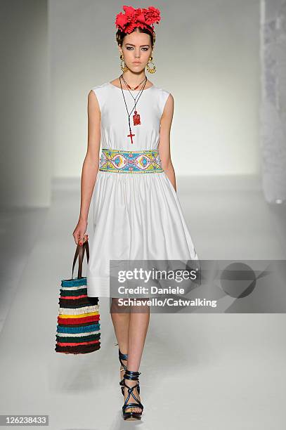 Model walks the runway at the Moschino Spring Summer 2012 fashion show during Milan Fashion Week on September 23, 2011 in Milan, Italy.