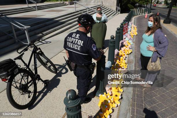 Capitol Police talk with Amanda Kloer and Melissa Byrne of ParentsTogether about their 'teddy bear sit in' in front of the Rayburn House Office...