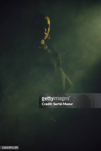 portrait of young sad woman in smoke - stock photo - spooky smoke stock pictures, royalty-free photos & images