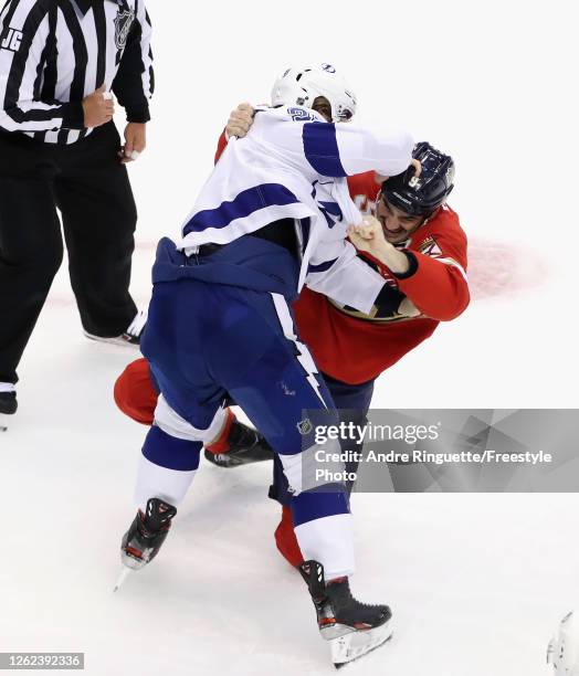 Brian Boyle of the Florida Panthers fights with Mikhail Sergadchev of the Tampa Bay Lightning during the third period in an exhibition game prior to...