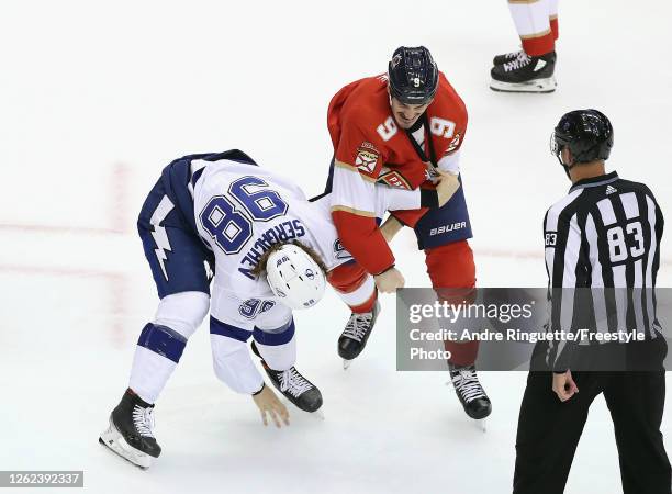 Brian Boyle of the Florida Panthers fights with Mikhail Sergadchev of the Tampa Bay Lightning during the third period in an exhibition game prior to...