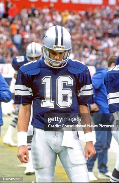 View of American football player Steve Pelluer, quarterback for the Dallas Cowboys leaves the field after a game at RFK Stadium, Washington DC,...