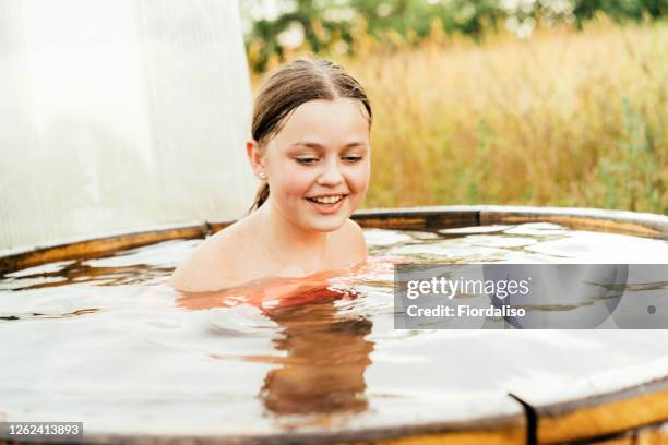 girl teenager long-haired - eis baden stock-fotos und bilder