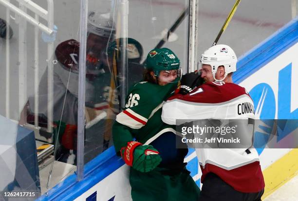 Kevin Connauton of the Colorado Avalanche hits Mats Zuccarello of the Minnesota Wild during the second period in an exhibition game prior to the 2020...