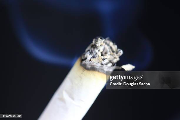 burning cigarette with ash debris - blank cigarette box stock pictures, royalty-free photos & images