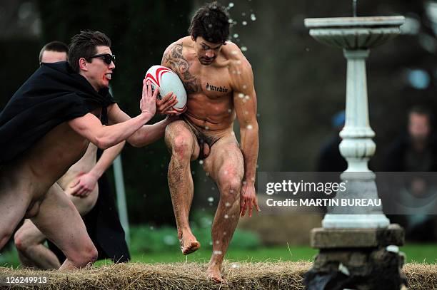 Player of the Nude Blacks is tackled by a player of the Romanian Vampires, on September 24 at Larnach castle in Dunedin, during the New Zealand 2011...