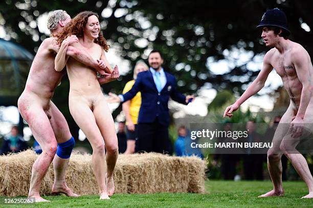 Nude Blacks players try to catch a streaker during their match against Romanian Vampires, on September 24 at Larnach castle in Dunedin, during the...