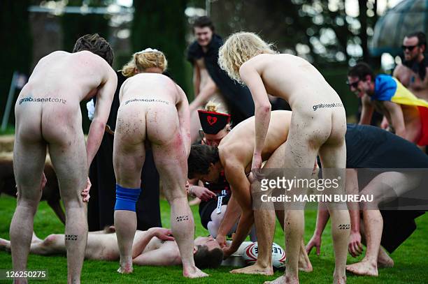 Player of the Nude Blacks lies on the ground after an injury during their match againt the Romanian Vampires, on September 24 at Larnach castle in...