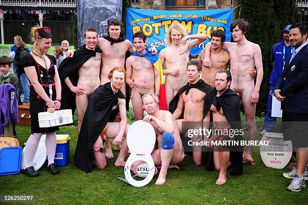 Players of the Nude Blacks and Romanian Vampires pose together, on September 24 at Larnach castle in Dunedin, during the New Zealand 2011 Rugby World...