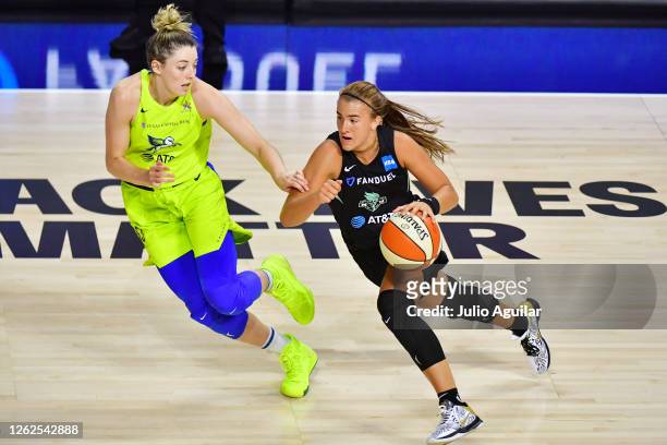 Sabrina Ionescu of the New York Liberty gets around Katie Lou Samuelson of the Dallas Wings during the second half of a game at Feld Entertainment...