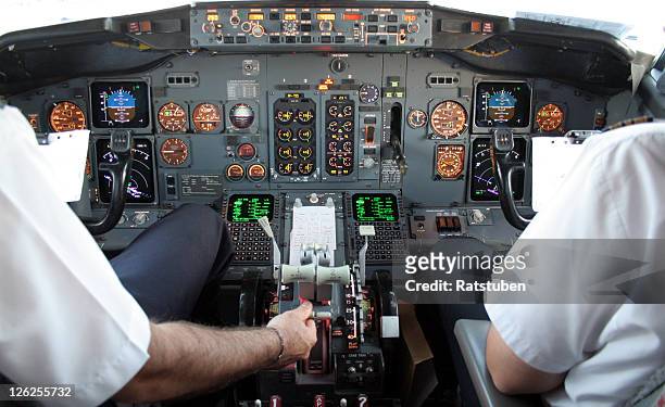 captain and co pilot in cockpit preparing for take off - autopilot stock pictures, royalty-free photos & images