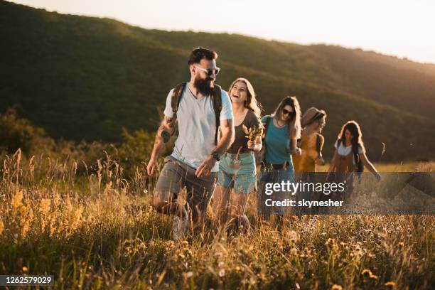 People In A Row Walking Photos and Premium High Res Pictures - Getty Images
