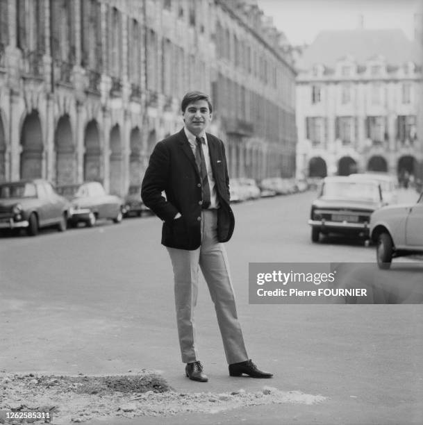 French singer Serge Lama outside.