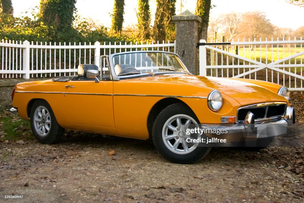Old yellow 1970’s classic british sports cars