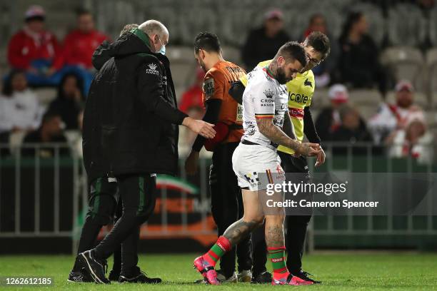 Adam Reynolds of the Rabbitohs is attended to by team trainers during the round 12 NRL match between the St George Illawarra Dragons and the South...