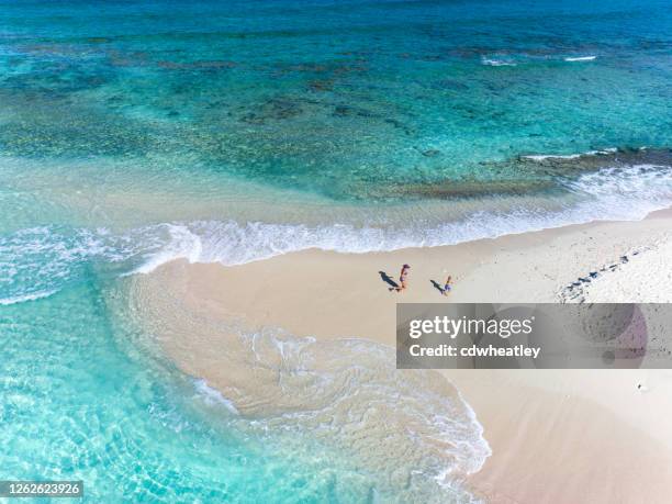 aerial view of mother and child on sandy spit, british virgin islands - cay stock pictures, royalty-free photos & images