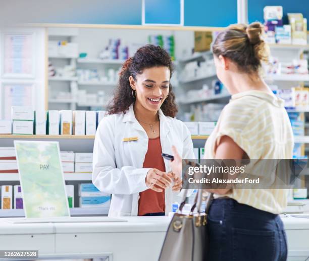 from diagnosing to dispensing, she does it all - pharmacist and patient stock pictures, royalty-free photos & images