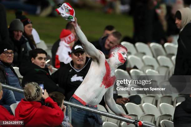 Dragons supporter throws a Dragons jersey during the round 12 NRL match between the St George Illawarra Dragons and the South Sydney Rabbitohs at...