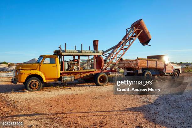 old mining vehicles, trucks in outback, desert landscape, white cliffs, australia - nsw rural town stock pictures, royalty-free photos & images