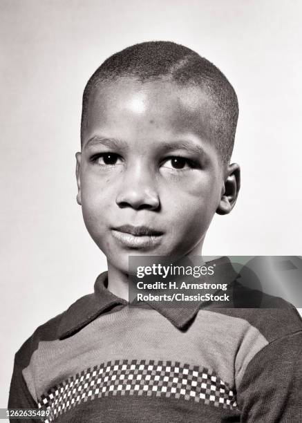 1940s Portrait African-American Boy Looking At Camera Serious Facial Expression