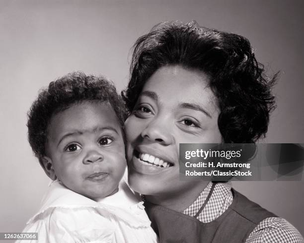 1960s Smiling Woman African-American Mother Looking Off Camera Side-By-Side With Her Smiling Daughter