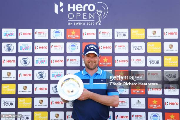 David Drysdale of Scotland poses with a Silver Salver presented to him for his 500th European Tour start after the first round of the Hero Open at...