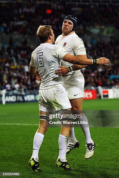 Tom Croft of England celebrates with teammate James Haskell after he scores their ninth try during the IRB 2011 Rugby World Cup Pool B match between...