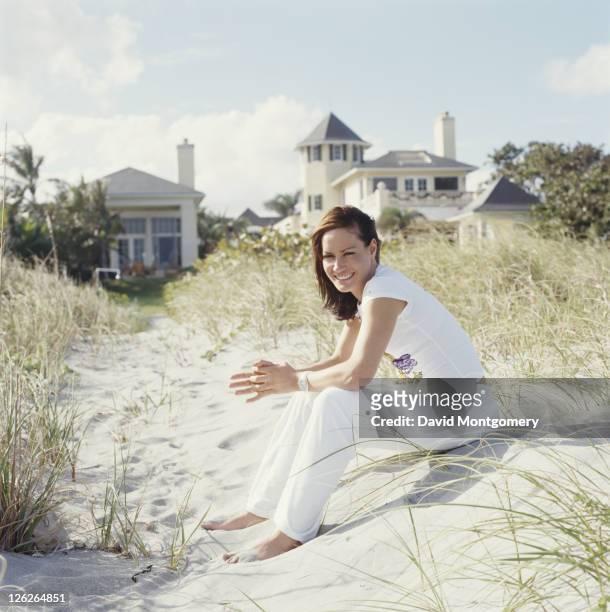 English socialite and columnist Tara Palmer-Tomkinson on a beach, 1998.