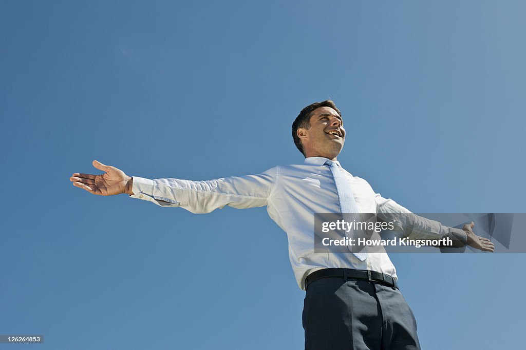 Man with arms outstretched