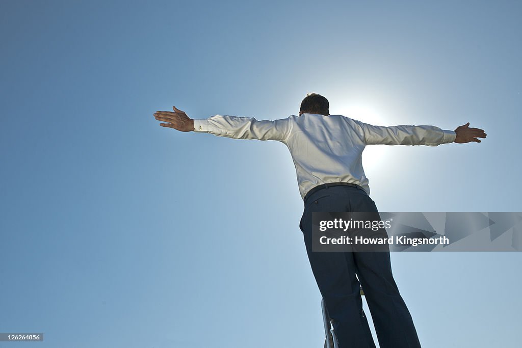 Man with arms outstretched