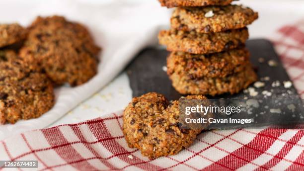 homemade oatmeal and chocolate cookies in the shape of a heart on a wh - syrup drizzle stock pictures, royalty-free photos & images