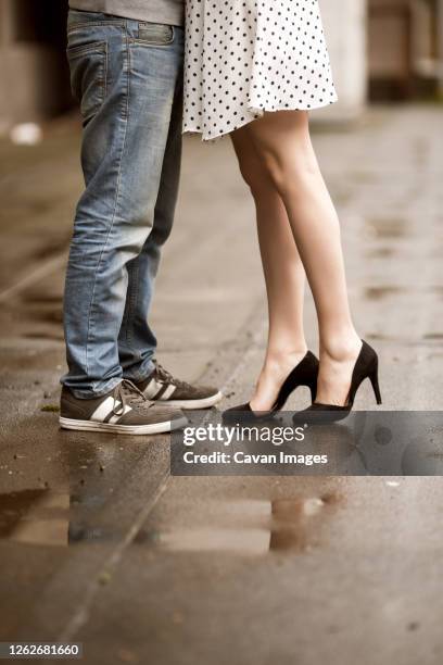 close up of kissing couple legs - kissing feet stock pictures, royalty-free photos & images