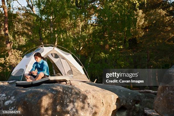 mature woman camping in the forest of fontainebleau close to paris - state park stock pictures, royalty-free photos & images
