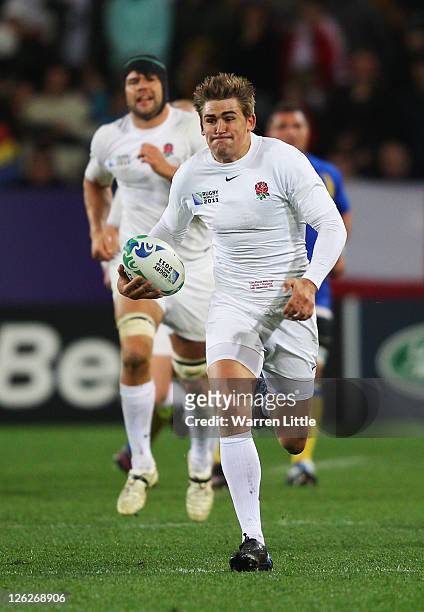 Toby Flood of England makes a break during the IRB 2011 Rugby World Cup Pool B match between England and Romania at Otago Stadium on September 24,...