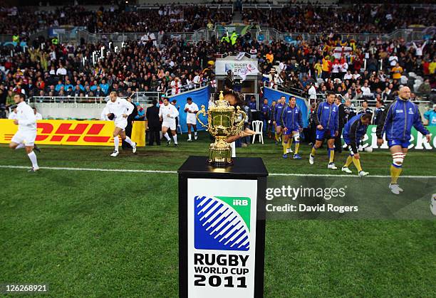 Players enter the pitch in front of The Webb Ellis cup ahead of the IRB 2011 Rugby World Cup Pool B match between England and Romania at Otago...