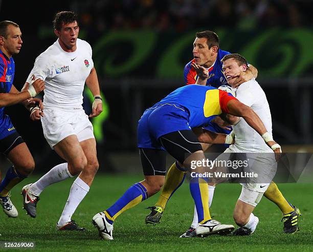 Chris Ashton is high tackled during the IRB 2011 Rugby World Cup Pool B match between England and Romania at Otago Stadium on September 24, 2011 in...