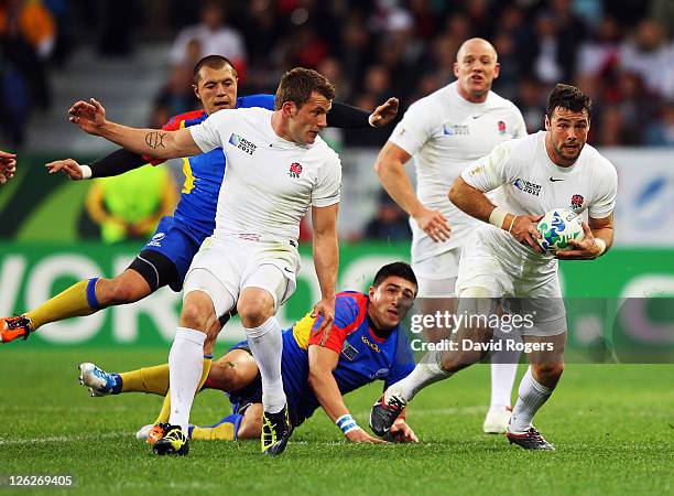 Ben Foden of England makes a break during the IRB 2011 Rugby World Cup Pool B match between England and Romania at Otago Stadium on September 24,...