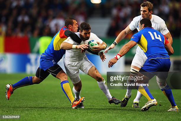 Ben Foden of England is tackled during the IRB 2011 Rugby World Cup Pool B match between England and Romania at Otago Stadium on September 24, 2011...