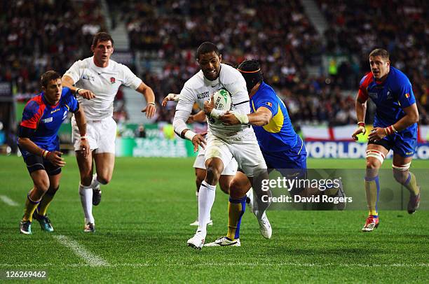 Delon Armitage of England is tackled during the IRB 2011 Rugby World Cup Pool B match between England and Romania at Otago Stadium on September 24,...