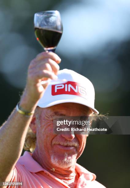 Miguel Angel Jimenez of Spain has a glass of wine after completing his round as he makes his 707th European tour start, a tour appearance record...