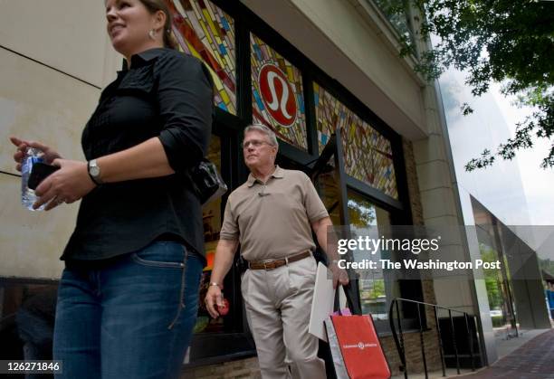 David Murray, , leaves Lululemon Athletica, a yoga clothing store, which reopened in Bethesda, Maryland, on Friday, June 24, 2011. Murray's...