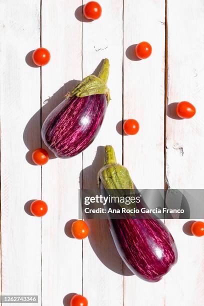 fresh eggplants and cherry tomatoes - aubergine stock pictures, royalty-free photos & images