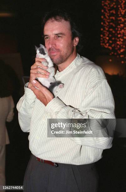 Actor comedian Kevin Nealon with kitten in Los Angeles, California in 1997.