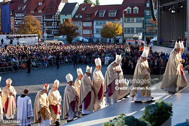 Catholic clergy arrives for a morning mass led by Pope Benedict XVI at Domplatz square in front of the Erfurter Dom cathedral on September 24, 2011...