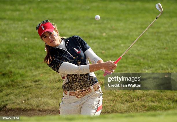 Paula Creamer of the USA hits from a bunker to the 18th green during the morning foursomes on day two of the 2011 Solheim Cup at Killeen Castle Golf...